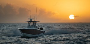 33 ft Open Fisherman cruising waters while the sun is setting.