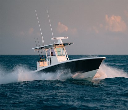 33 ft. center console cruising through open ocean.