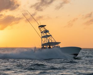 Luxury Invincible Boats with sun-peeking background.