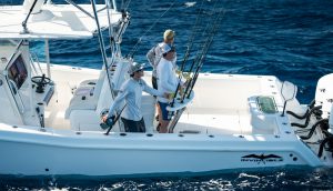 3 people fishing from an invincible boat